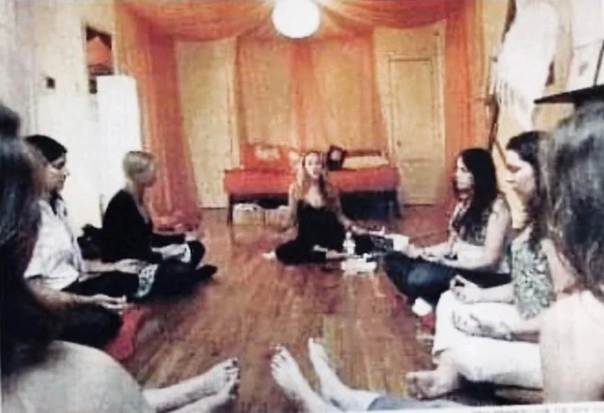 People meditating in Gabby's apartment